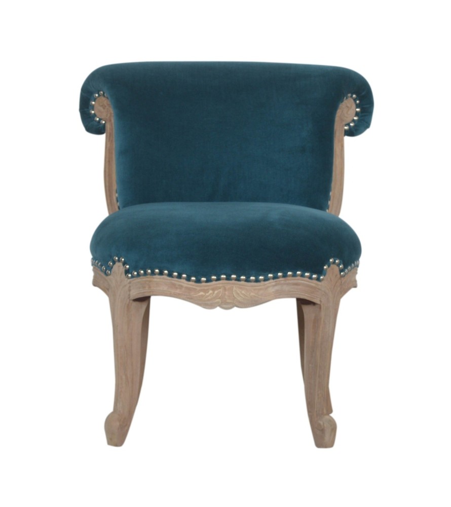 Fauteuil clouté en velours turquoise