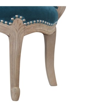 Fauteuil clouté en velours turquoise
