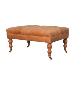 Pouf en cuir fauve avec pieds à roulettes