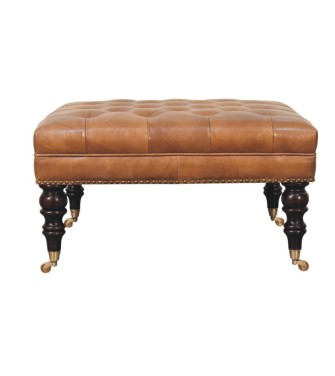 Pouf en cuir de buffle beige clouté avec pieds à roulettes